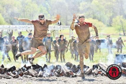 My buddy Justin and I jumping the fire at the finish line!